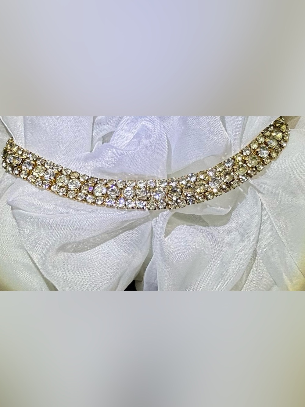 Vintage three-row rhinestone choker necklace set in a gold-tone band.